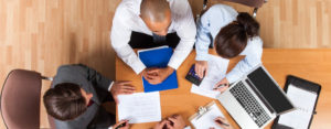 group of business people with paperwork