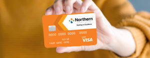 woman holding a Northern credit card