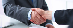 two businessmen shaking hands