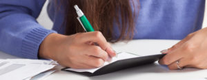 woman writing a check