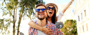 happy couple riding on scooter