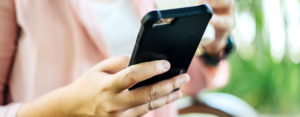 woman holding a cell phone